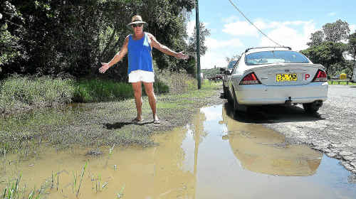 Wet underfoot: Des Roberts wants this muddy mess cleaned up at the Boronia Park carpark at Sawtell. Wet underfoot: Des Roberts wants this muddy mess cleaned up at the Boronia Park carpark at Sawtell.